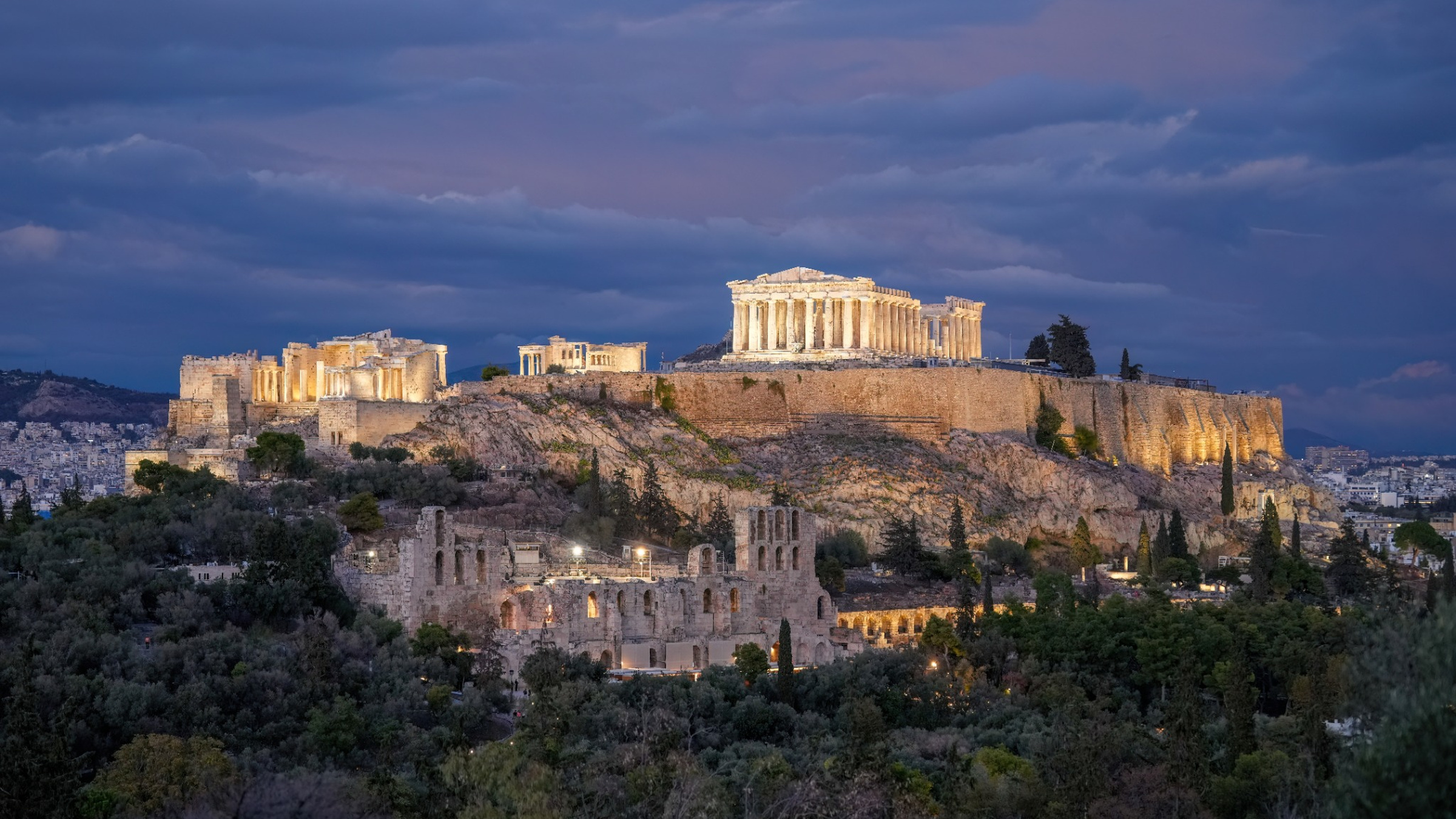 The Acropolis at dusk above the Odeon of Herodes Atticus, a few minutes’ walk from the NIA